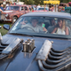 A photo of a group of people sat in a modified car at the Cineramageddon installation at Glastonbury.